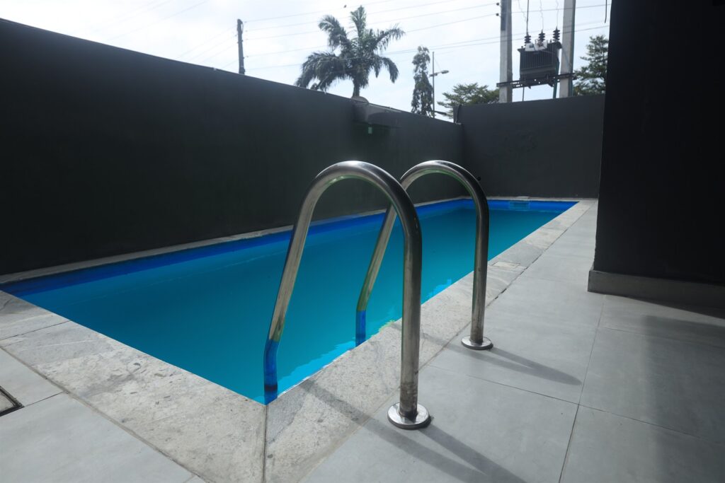 Brum Height 5: Outdoor swimming pool with a metal access ladder